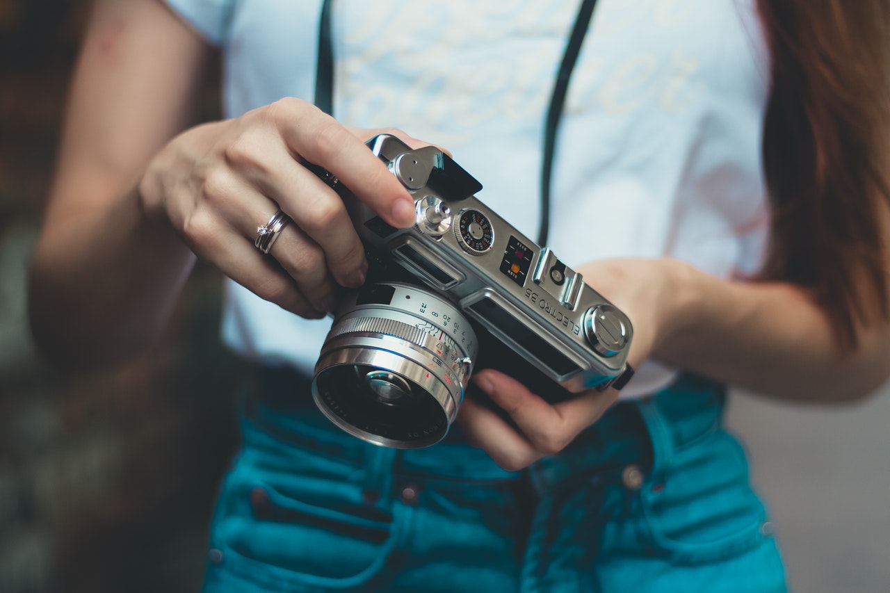 woman holding a camera