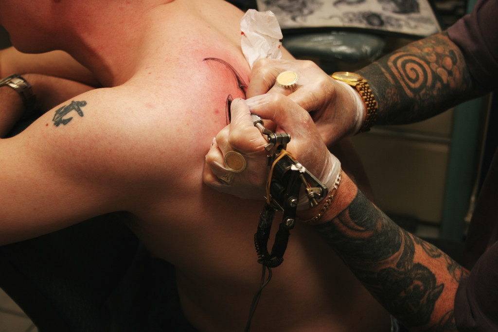 man getting a tattoo